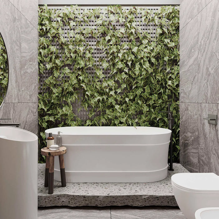Otti Attica Bath in front of natural feature wall
